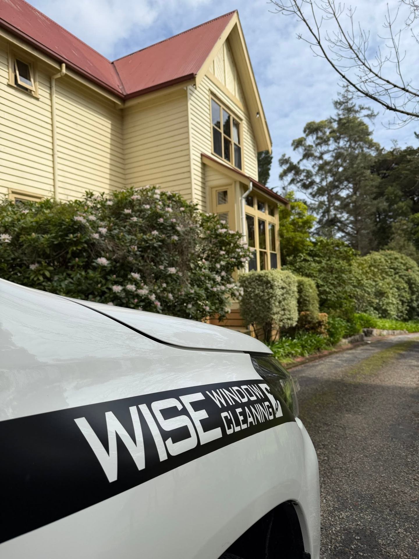 Wise Window Cleaning vehicle parked at a Hobart heritage home